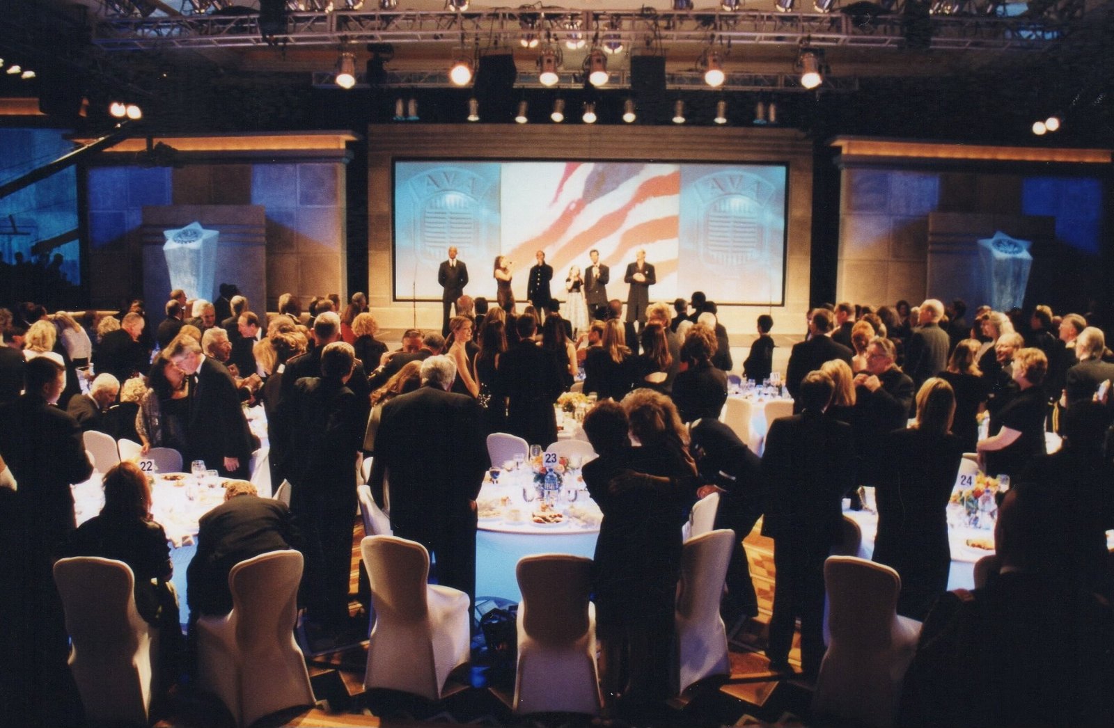 The American Veteran Awards stage with audience and color guard